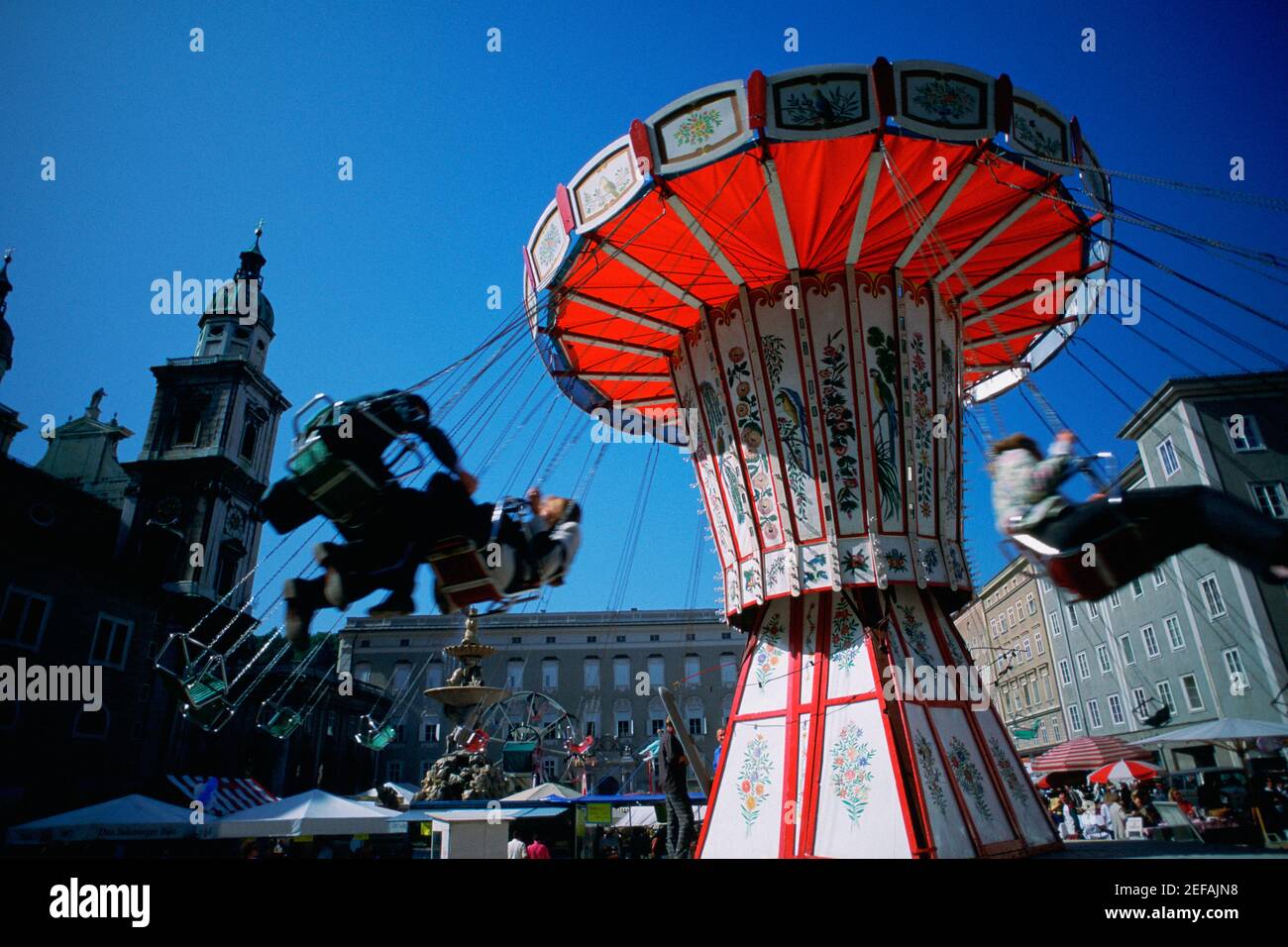 Low angle view of a chain swing ride at a carnival, Salzburg, Austria Stock Photo