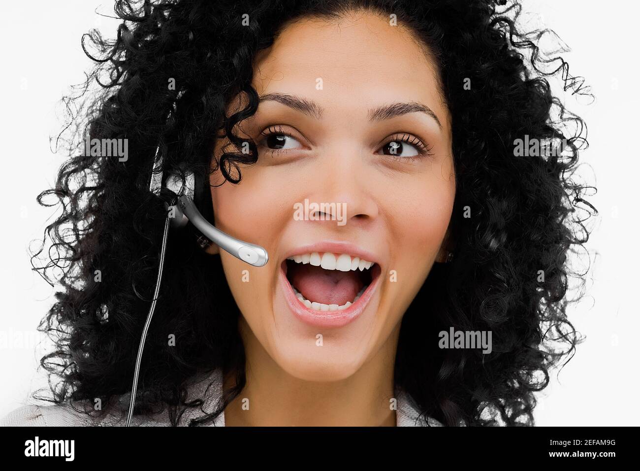 Close up of a female customer service representative wearing a headset ...