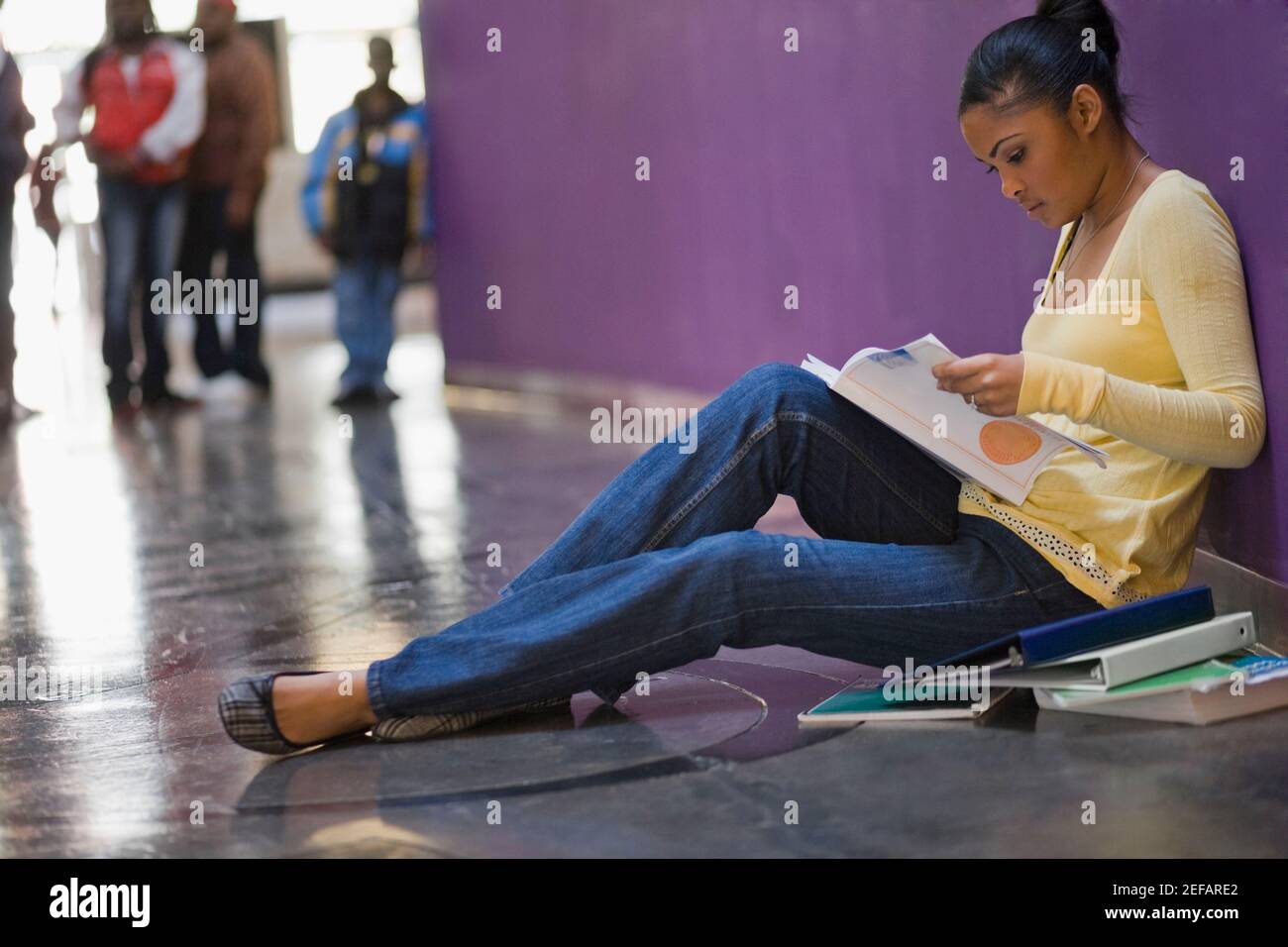 African woman sitting alone side view hi-res stock photography and ...