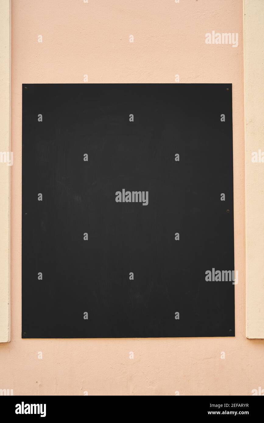 Empty chalk board as a mock-up template on the wall of a restaurant or cafe for menu Stock Photo