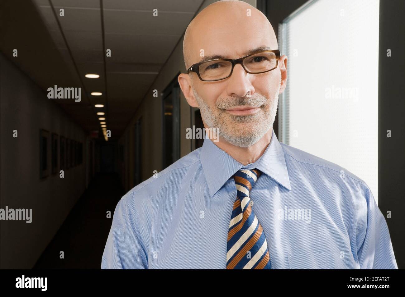 Portrait of a businessman smiling Stock Photo - Alamy