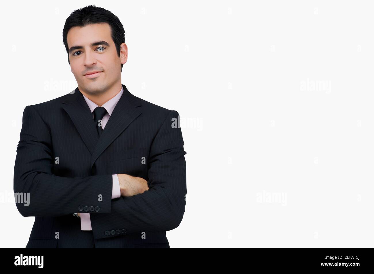 Portrait of a businessman standing with his arms crossed Stock Photo ...