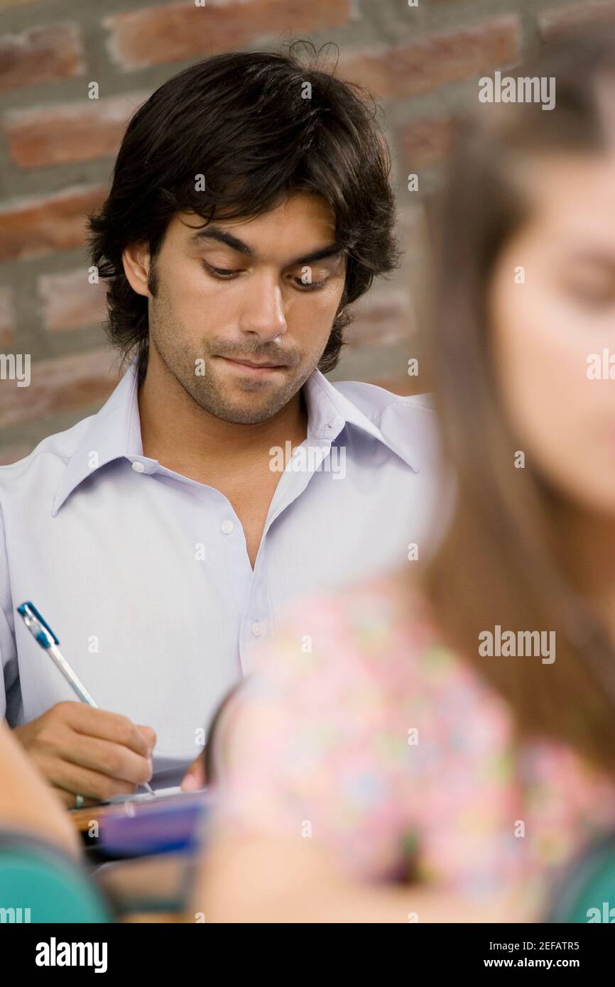 Two university students studying in a classroom Stock Photo - Alamy