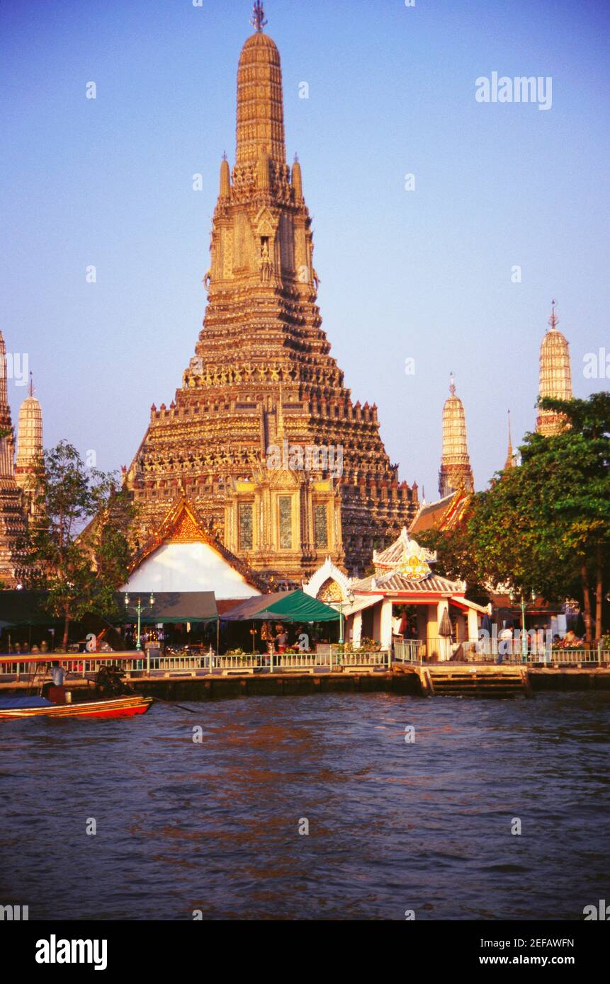 temple-on-the-bank-of-a-river-wat-arun-bangkok-thailand-stock-photo