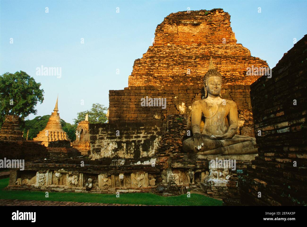 Old ruins of a statue of Buddha at a temple, Si Satchanalai Historical Park, Sukhothai, Thailand Stock Photo