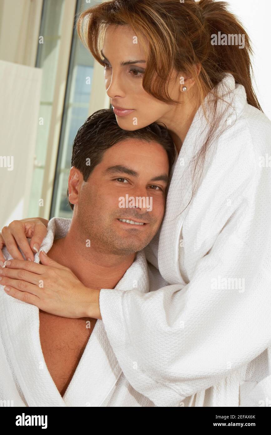Portrait of a mid adult woman embracing a mid adult man Stock Photo