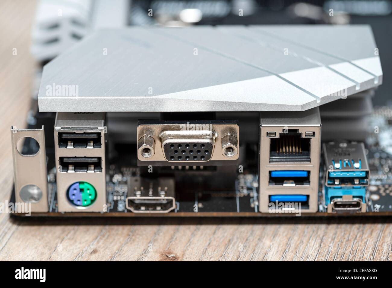 The rear panel of a desktop computer motherboard with visible connectors,  USB, VGA, PS2 and RJ45 network card Stock Photo - Alamy