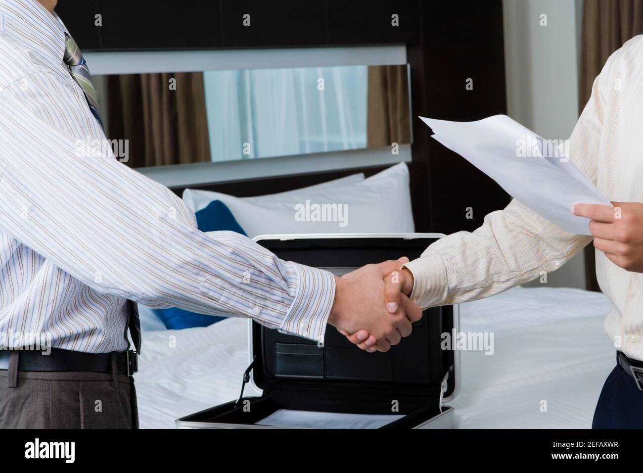 Two businessmen shaking hands Stock Photo