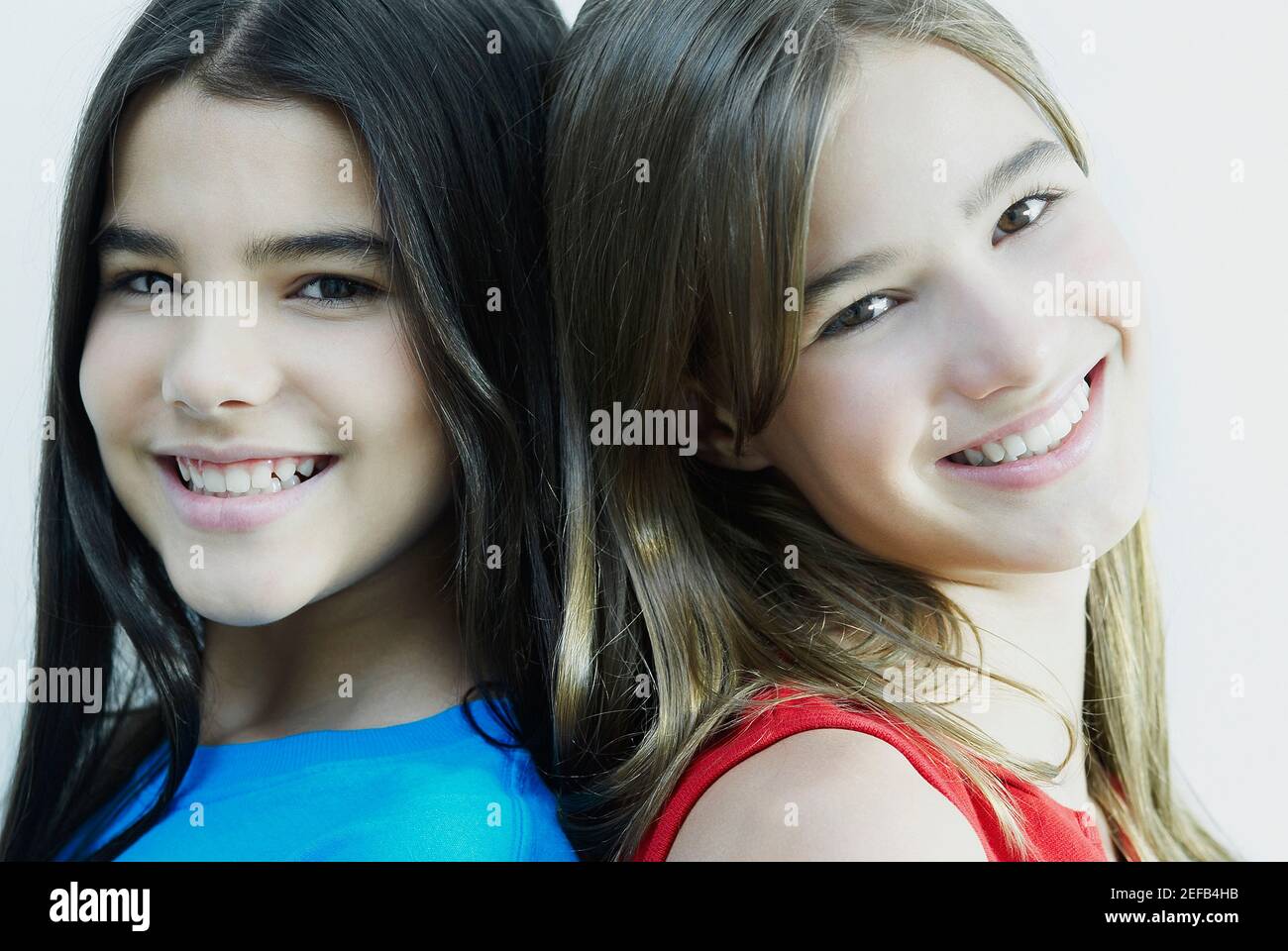 Portrait of two girls smiling Stock Photo - Alamy