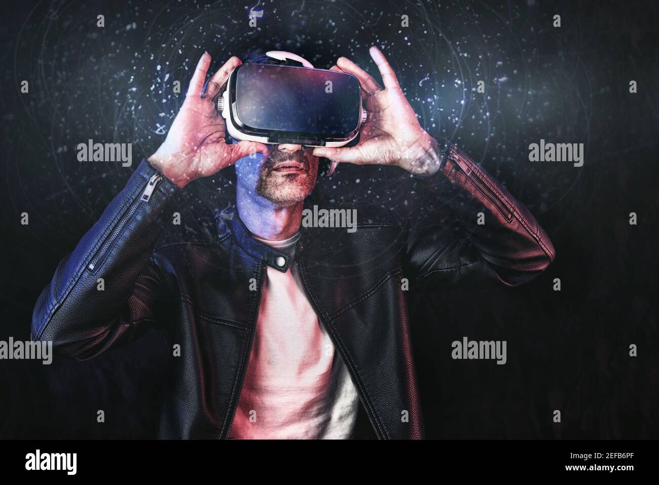cyberman  using content in virtual reality glasses with dark isolated background Stock Photo