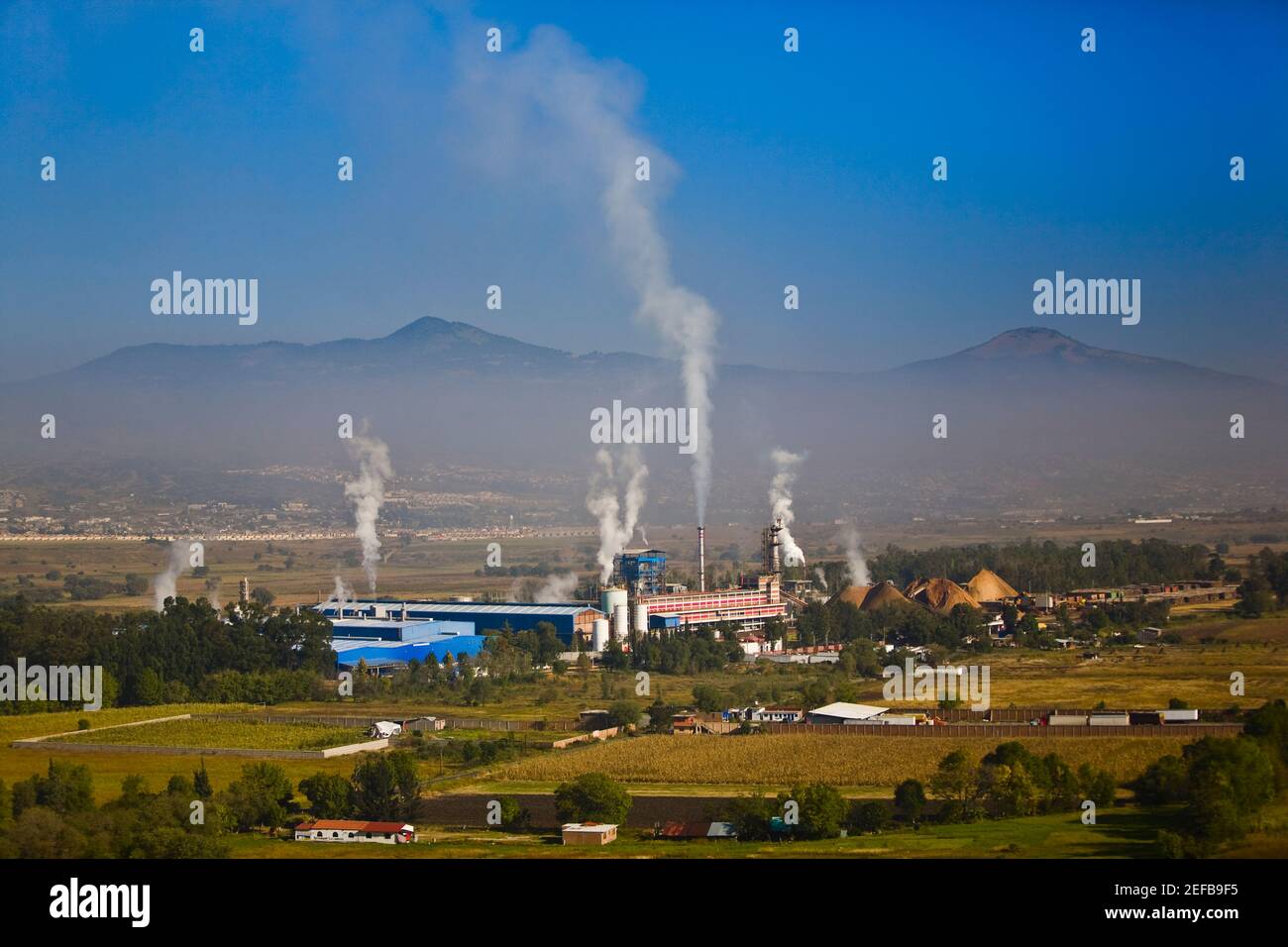 Smoke emitting from smoke stacks, Morelia, Michoacan State, Mexico Stock Photo