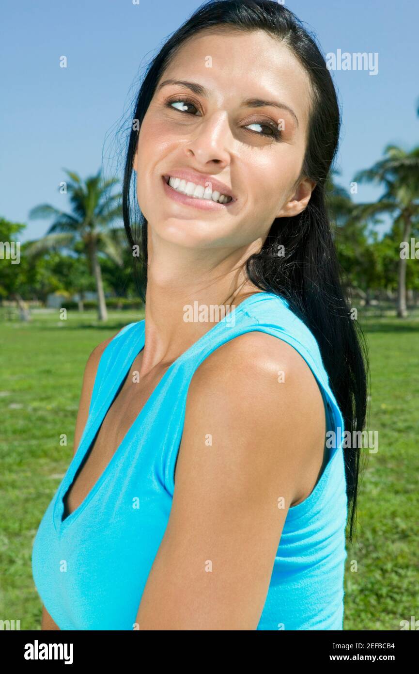 Side profile of a young woman smiling Stock Photo