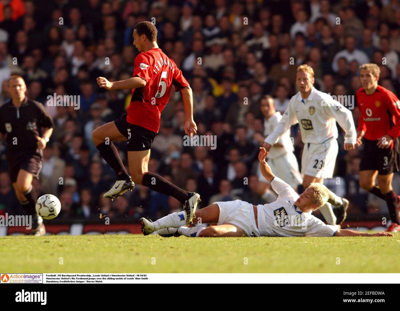 Football Fa Barclaycard Premiership Leeds United V Manchester United 18 10 03 Manchester United S Rio Ferdinand Jumps Over The Sliding Tackle Of Leeds Alan Smith Mandatory Credit Action Images Darren Walsh Stock Photo Alamy