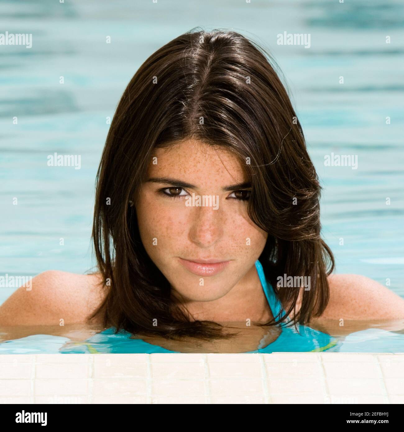 Portrait of a young woman in a swimming pool Stock Photo - Alamy