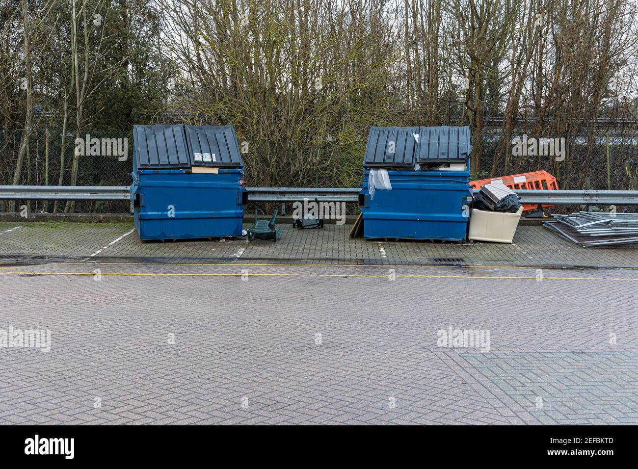 Blue dumpsters with rubbish, garbage in them Stock Photo