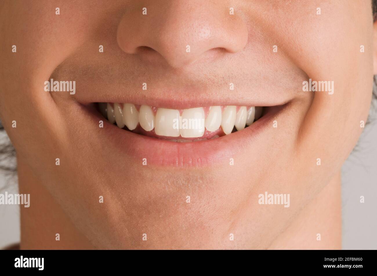 Close up of a young man smiling Stock Photo - Alamy