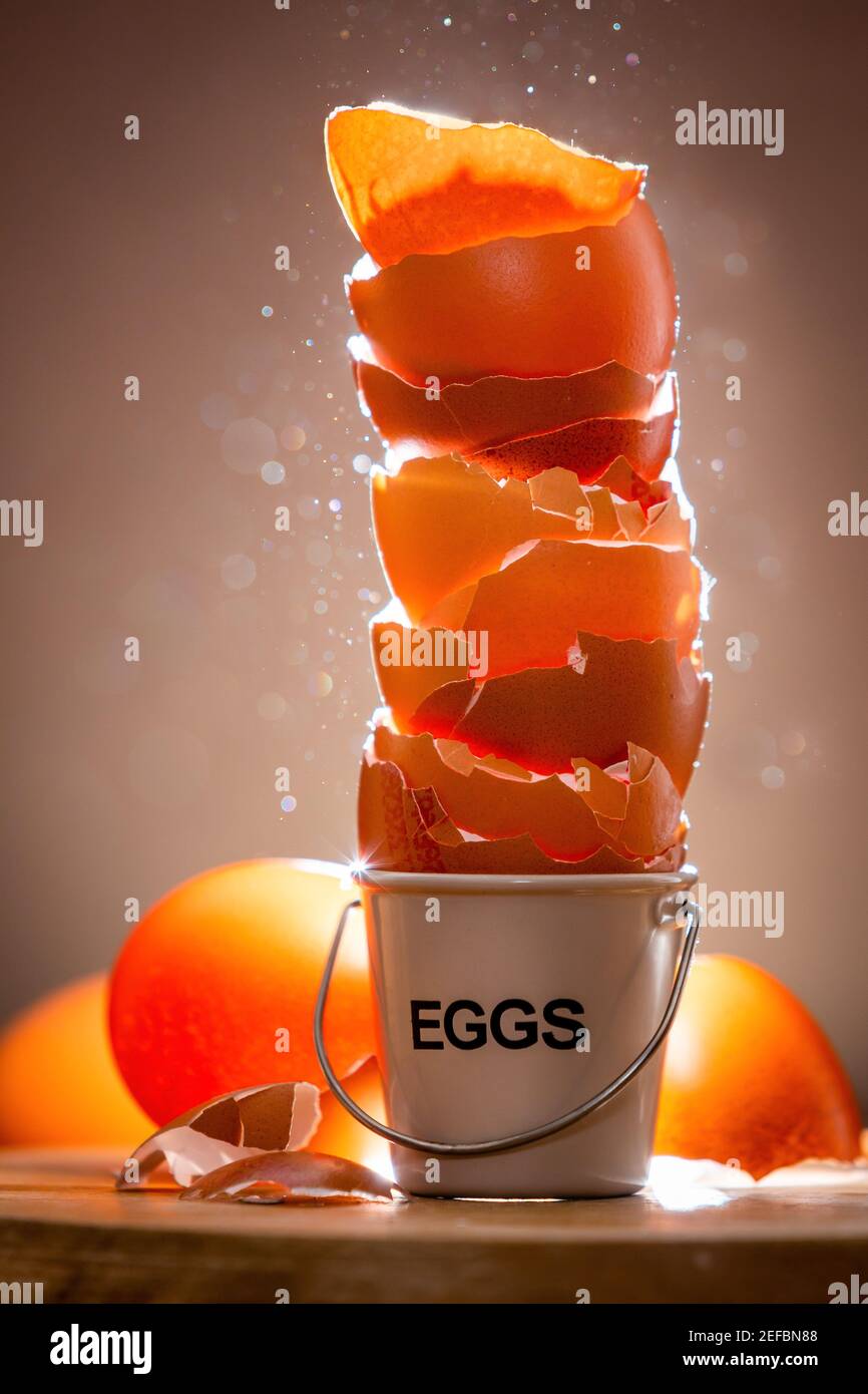Eggshells stacked in a small eggcup Stock Photo