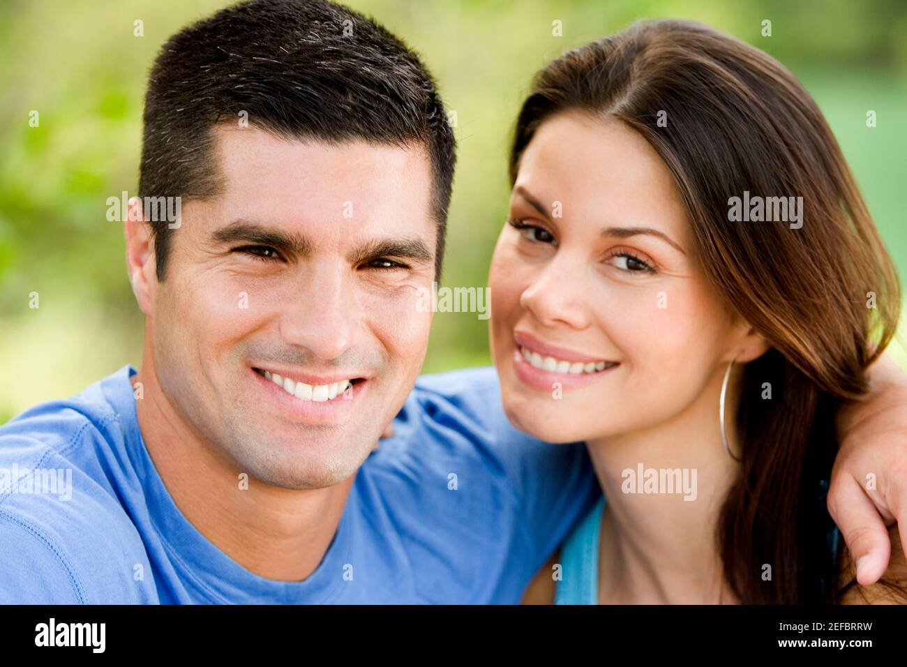 Portrait of a mid adult man and a young woman smiling Stock Photo - Alamy