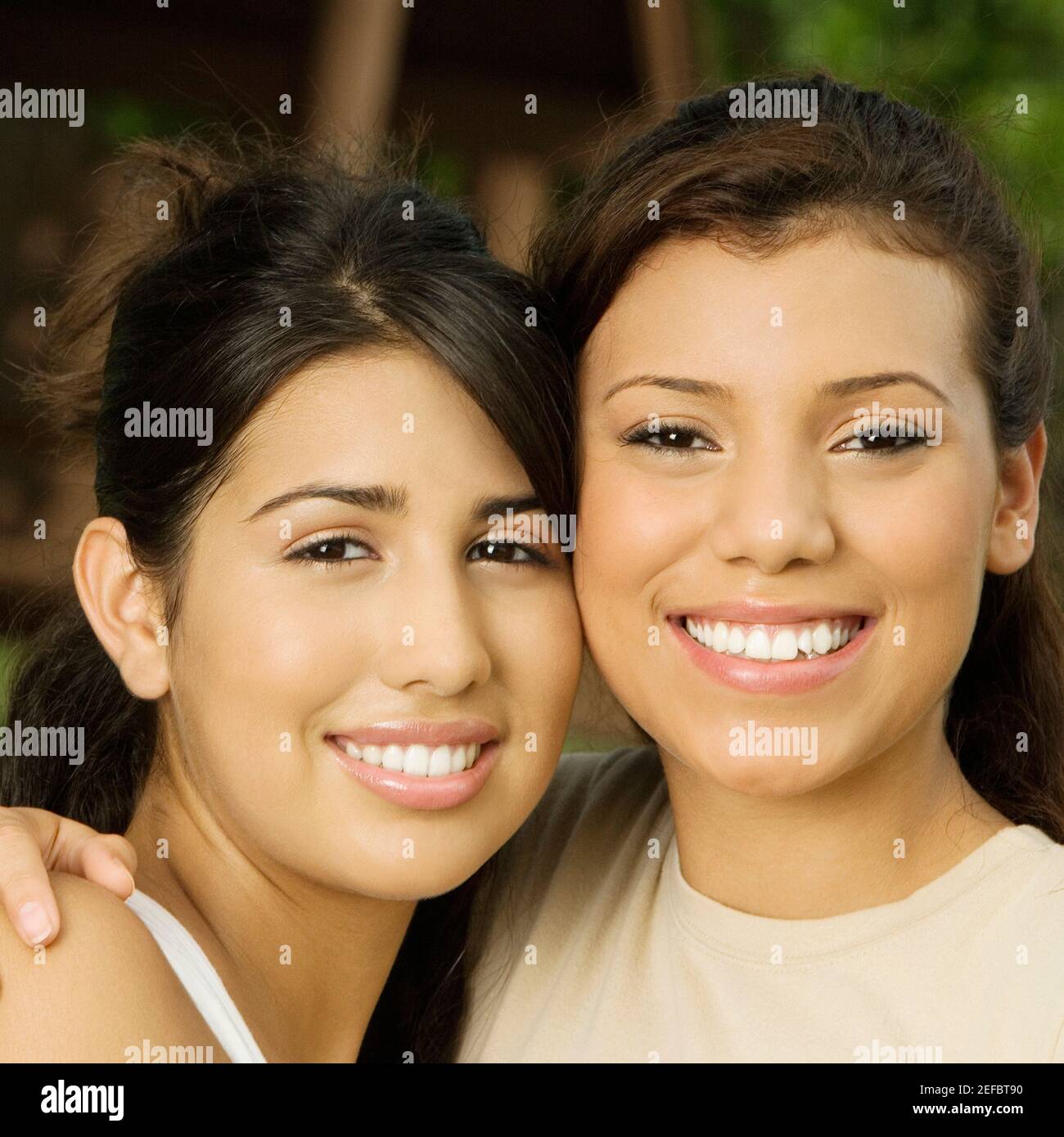 Close-up of two teenage girls smiling Stock Photo