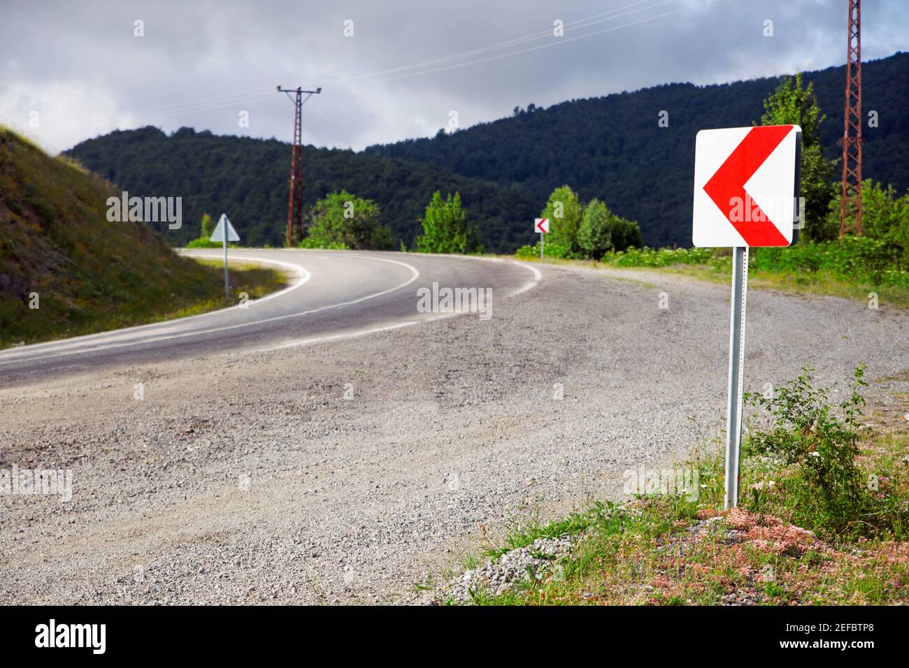 Turn sign in highway in Turkey. Warning sign on the road. Stock Photo