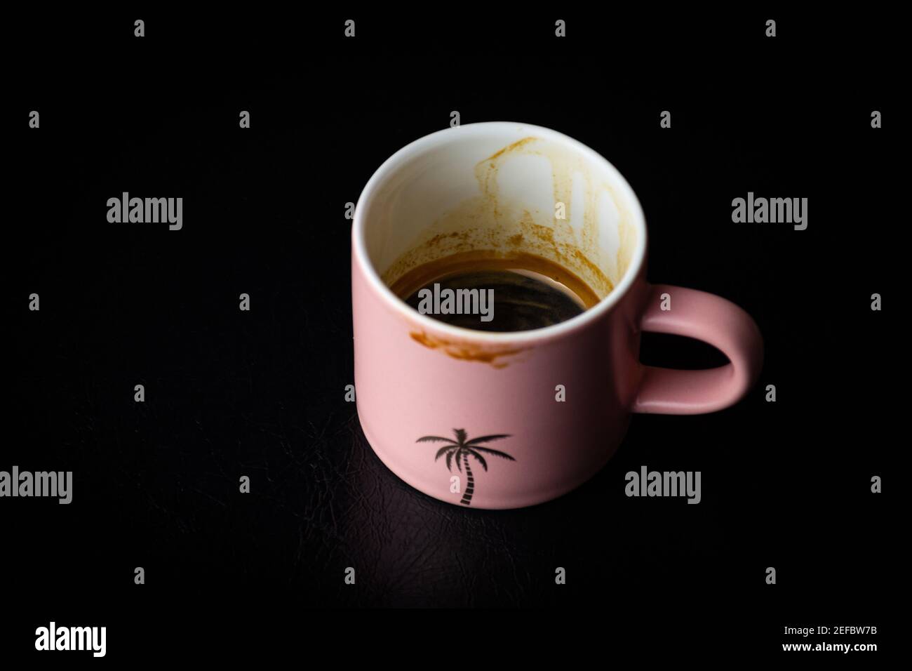 A Matte Pink Palm Tree Espresso Cup Stock Photo