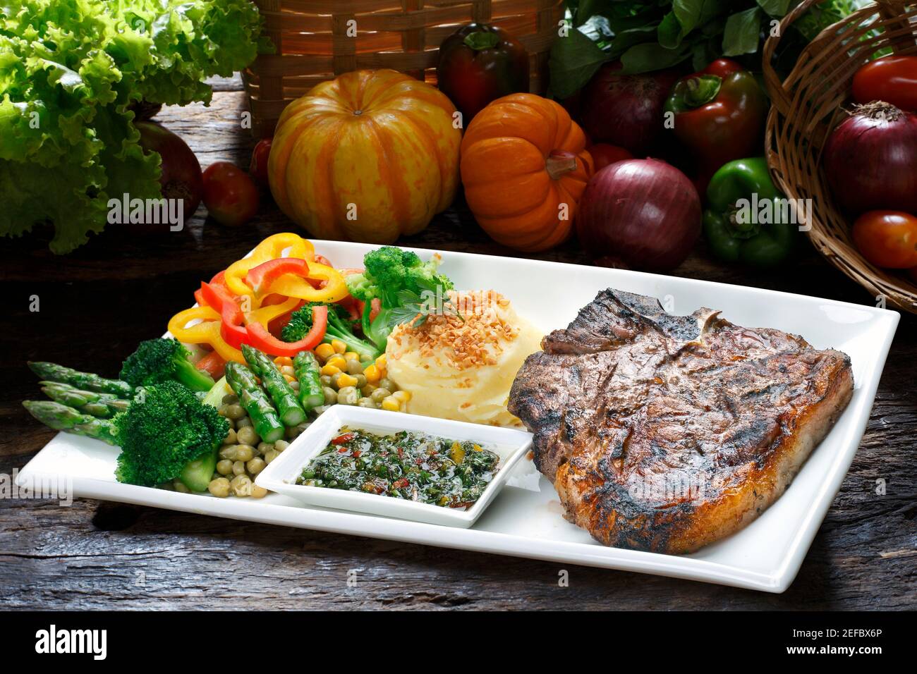 t bone steak with potato salad and vegetables Stock Photo - Alamy
