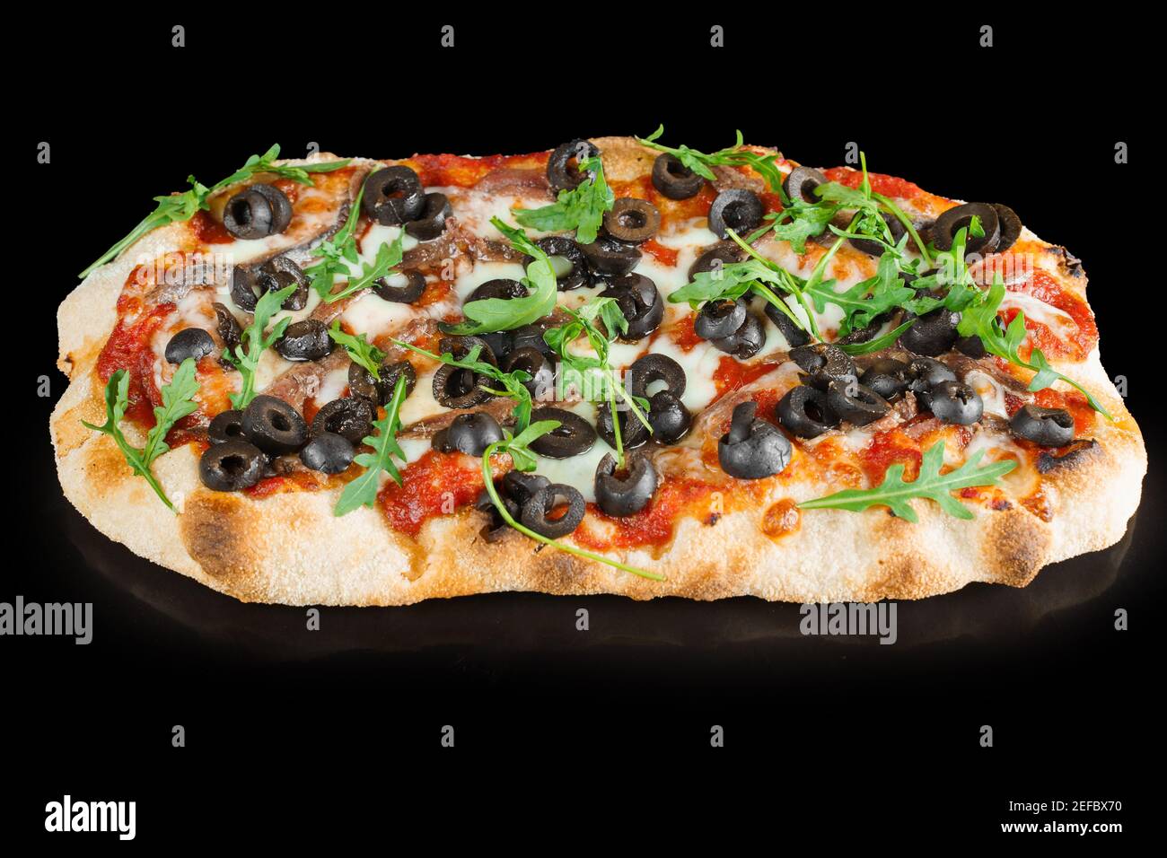 Pinsa romana gourmet italian cuisine on black wooden background.  Scrocchiarella traditional dish. Food delivery from pizzeria. Pinsa with  meat, arugul Stock Photo - Alamy