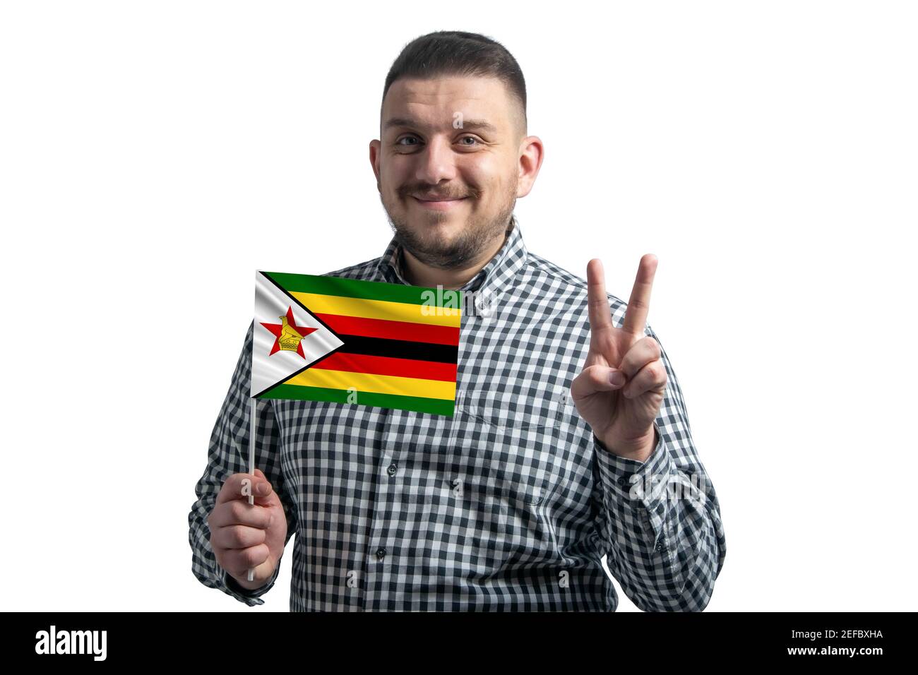 White guy holding a flag of Zimbabwe and shows two fingers isolated on