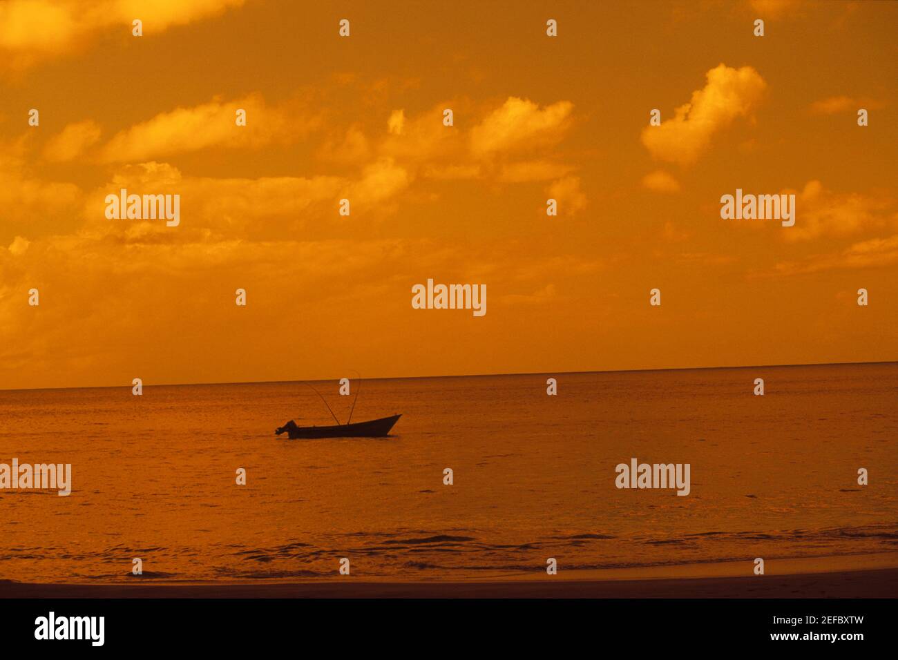 Silhouette of a boat in the sea hi-res stock photography and images - Alamy
