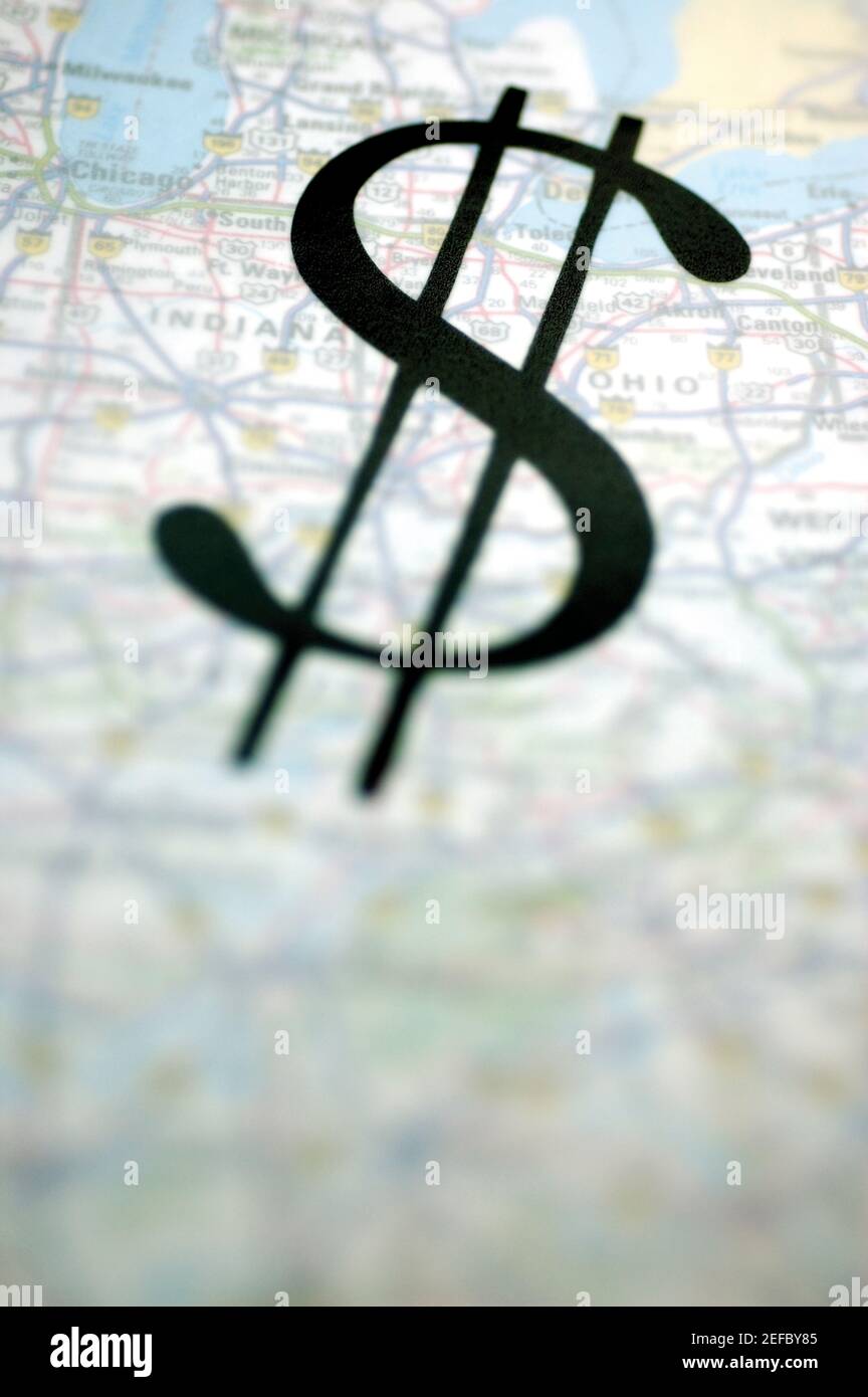 Close-up of a dollar sign on a globe Stock Photo