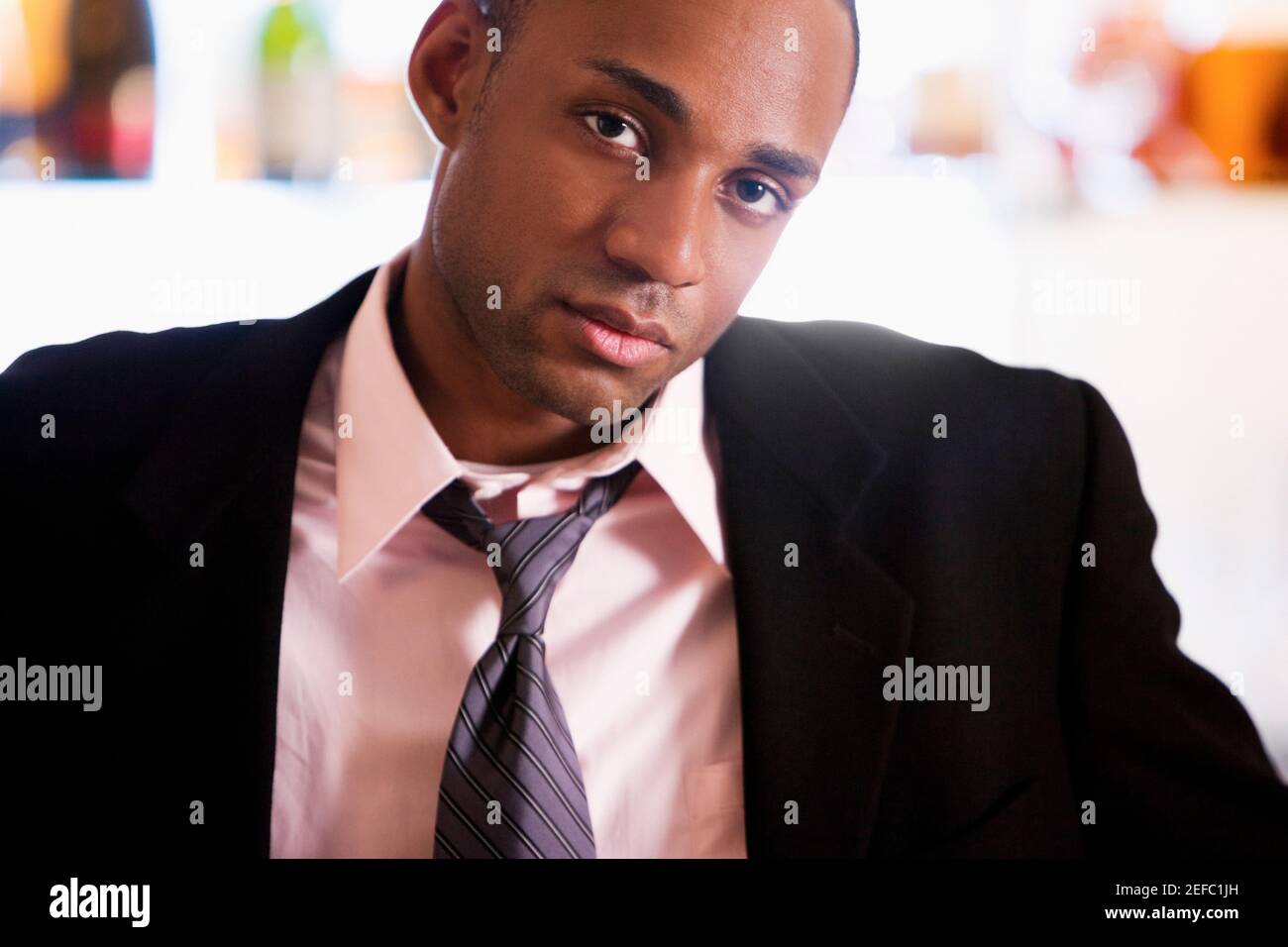 Contemplative african young man hi-res stock photography and images - Alamy