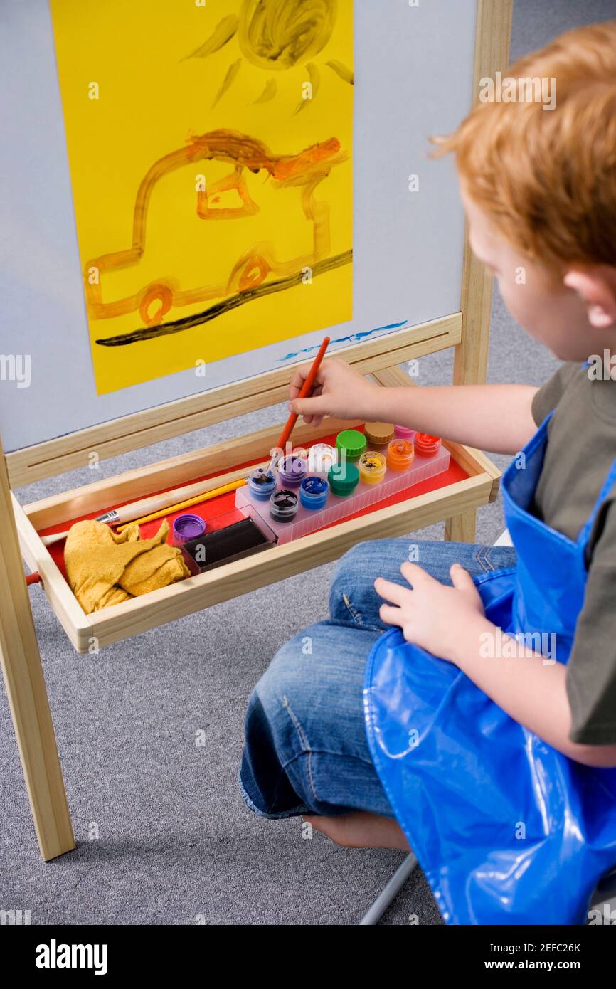 High angle view of a schoolboy painting in an art class Stock Photo - Alamy