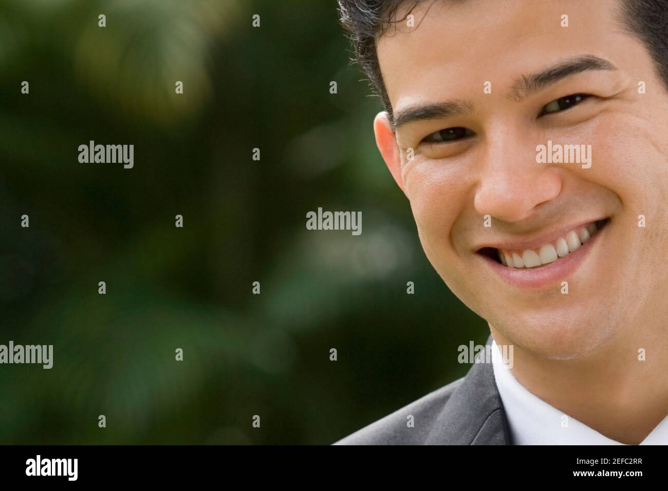 Portrait of a businessman smiling Stock Photo - Alamy
