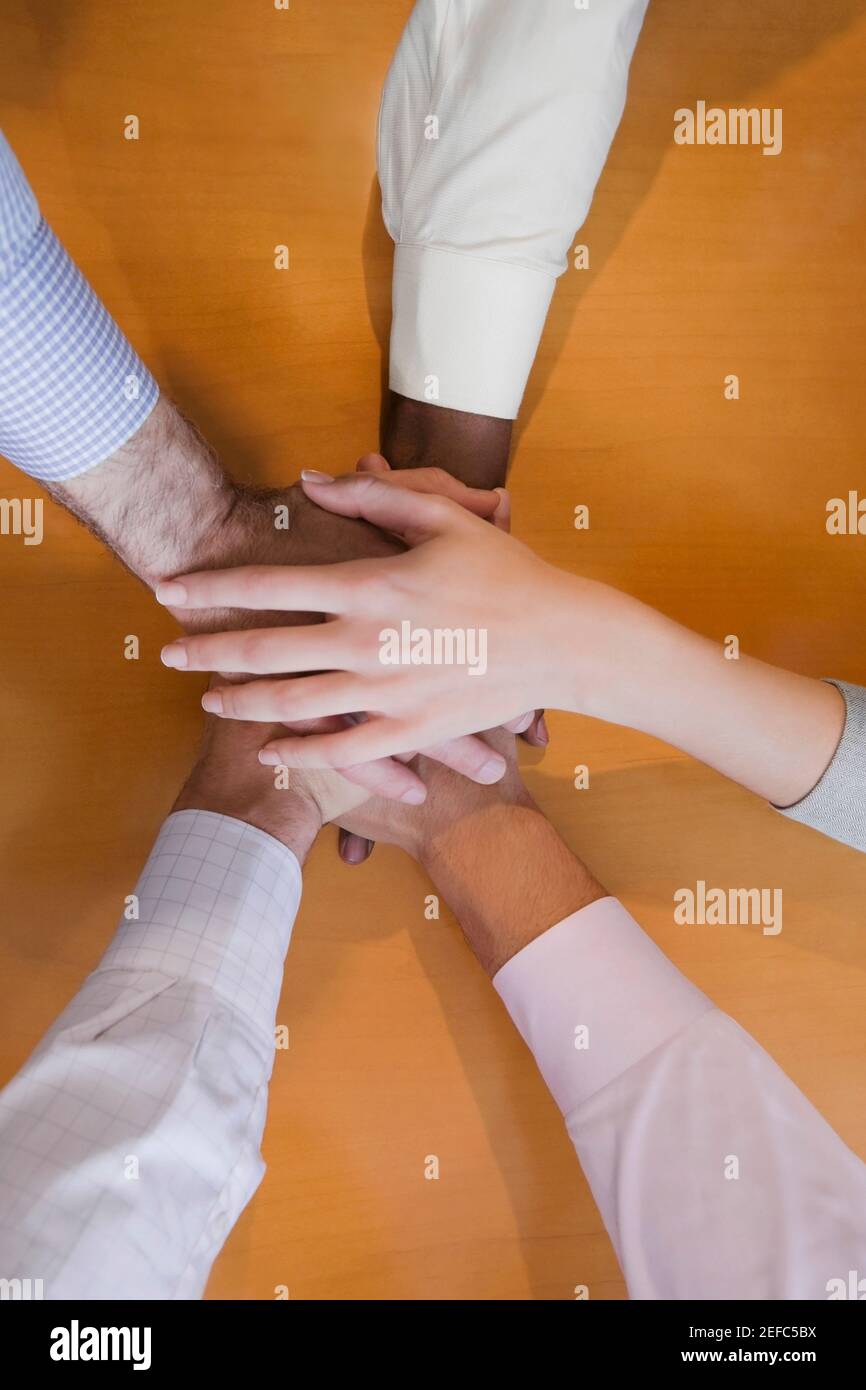 Hands on top of each other business hi-res stock photography and images ...
