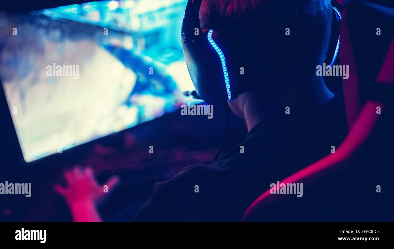 Professional gamer playing online games tournaments pc computer with