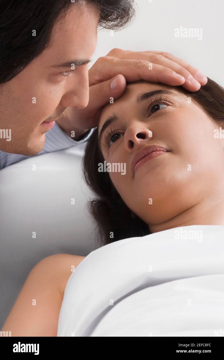 Close up of a mid adult man consoling a female patient Stock Photo