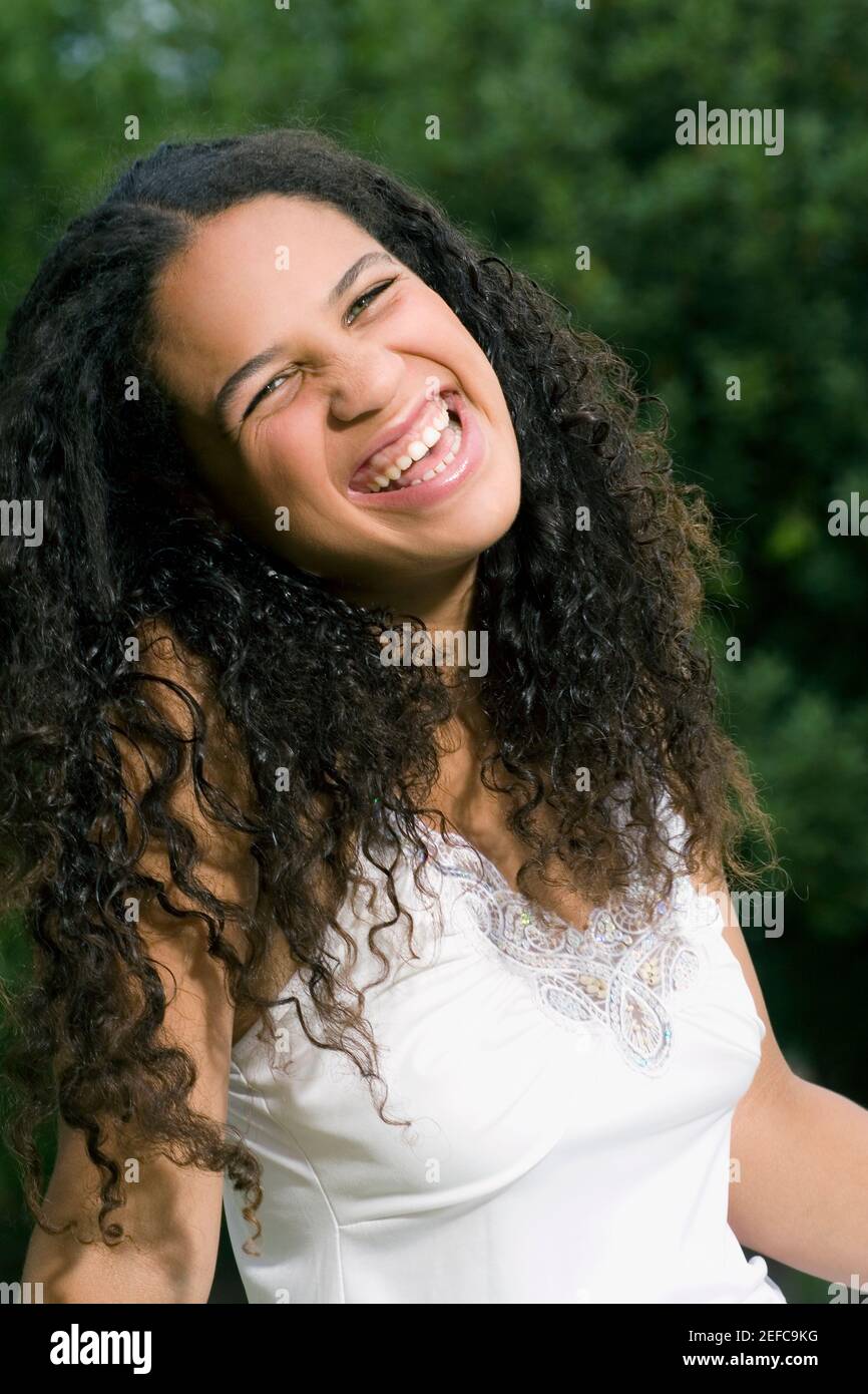 Portrait of a teenage girl smiling Stock Photo - Alamy