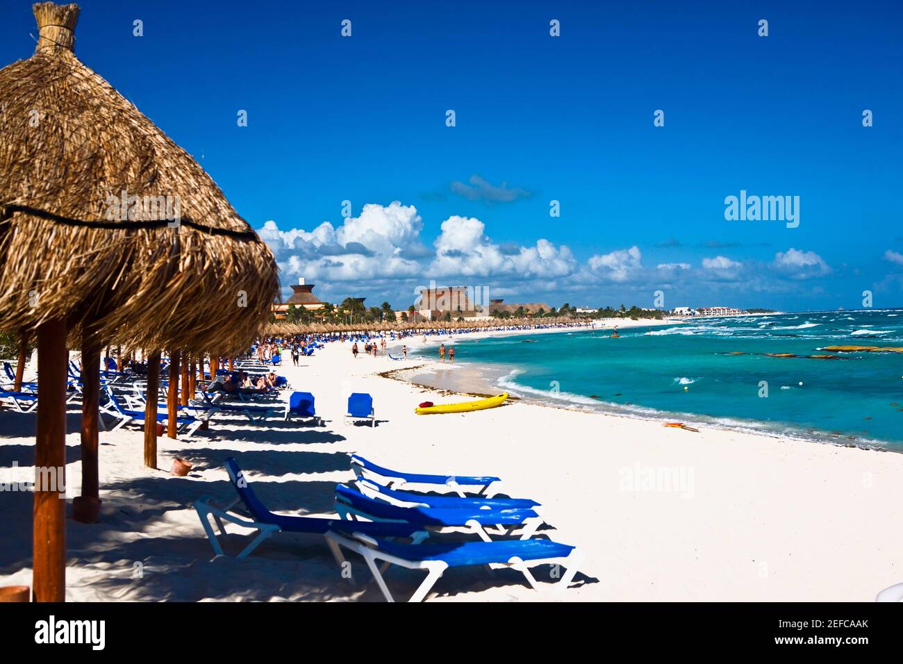 Palapas and lounge chairs on the beach, Tulum, Quintan Roo, Mexico
