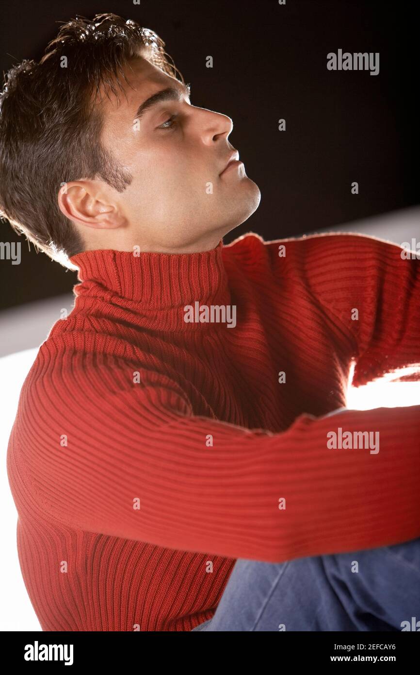 Man sitting knees up looking hi-res stock photography and images - Alamy