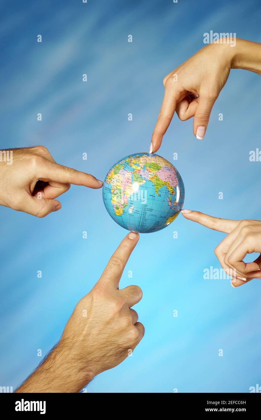 Two people holding up globe hi-res stock photography and images - Alamy