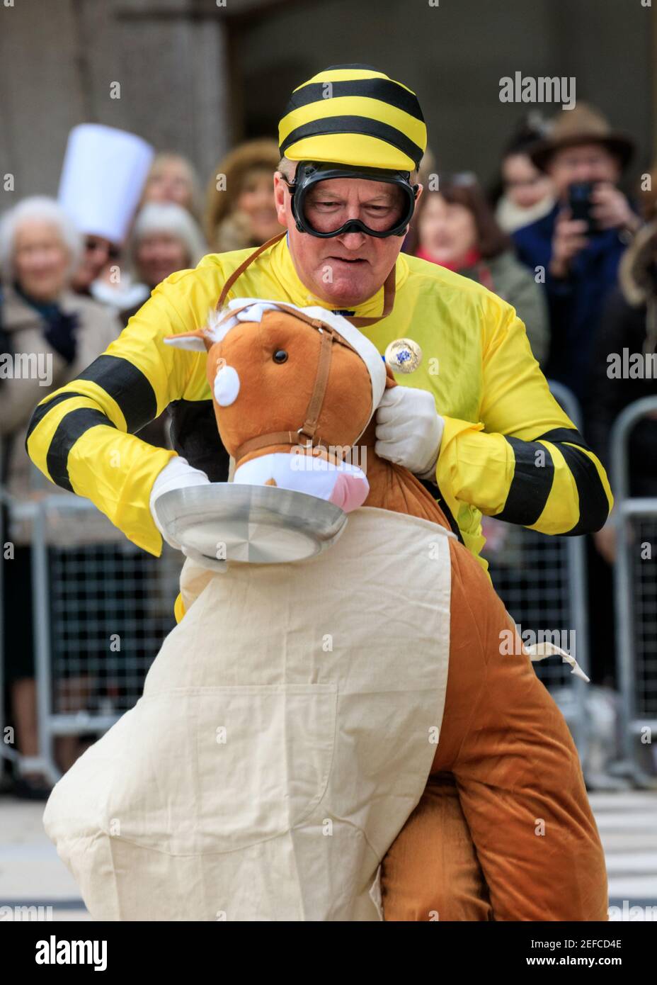 Participant from the Worshipful Company of Farmers at the  Shrove Tuesday Inter-Livery pancake races, London, UK Stock Photo