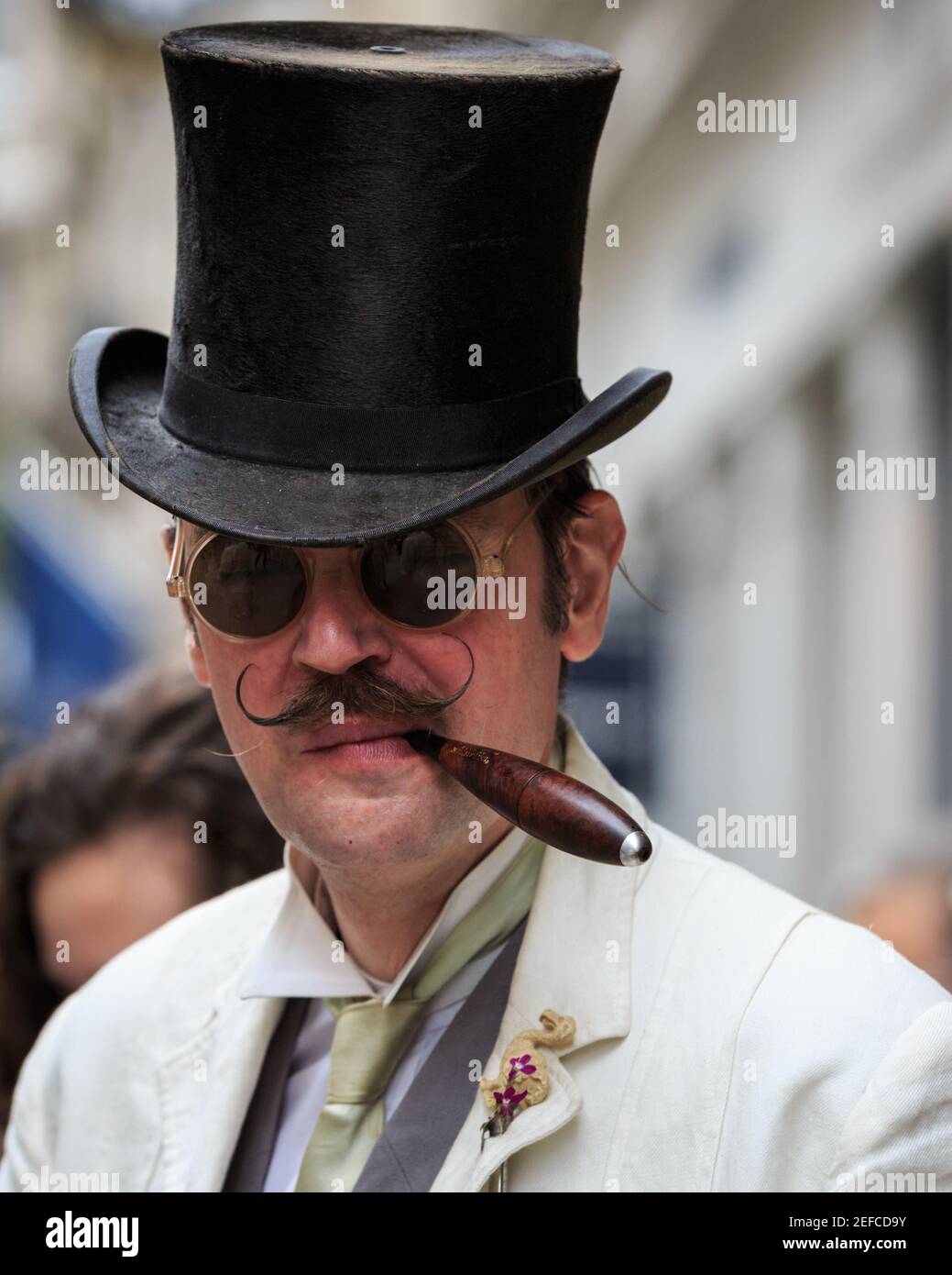 British Dandy Chap in top hat smoking cigar, at ' The Grand Flaneur