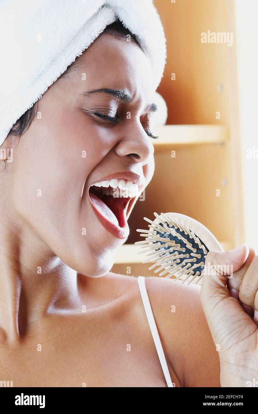 Singing into a hairbrush hi-res stock photography and images - Alamy