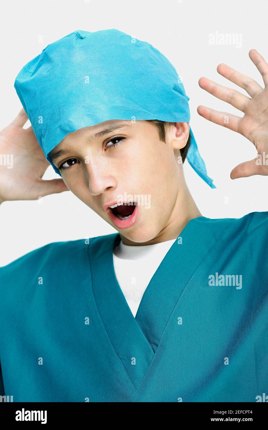 Close up of a boy wearing surgical scrubs and yawning Stock Photo Alamy
