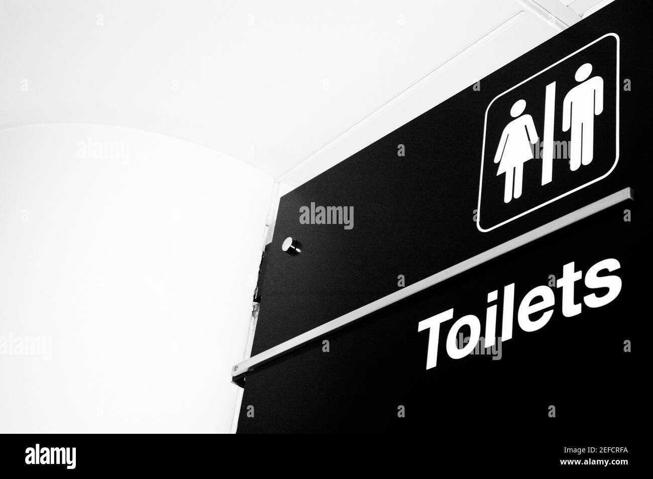 Low angle view of a restroom sign Stock Photo
