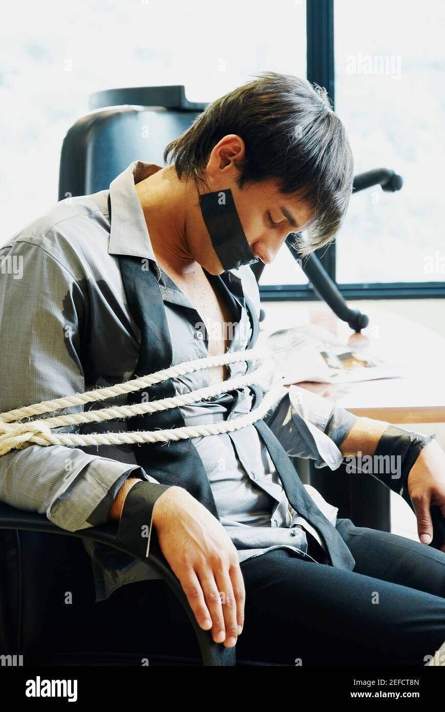 Man tied to chair hires stock photography and images Alamy