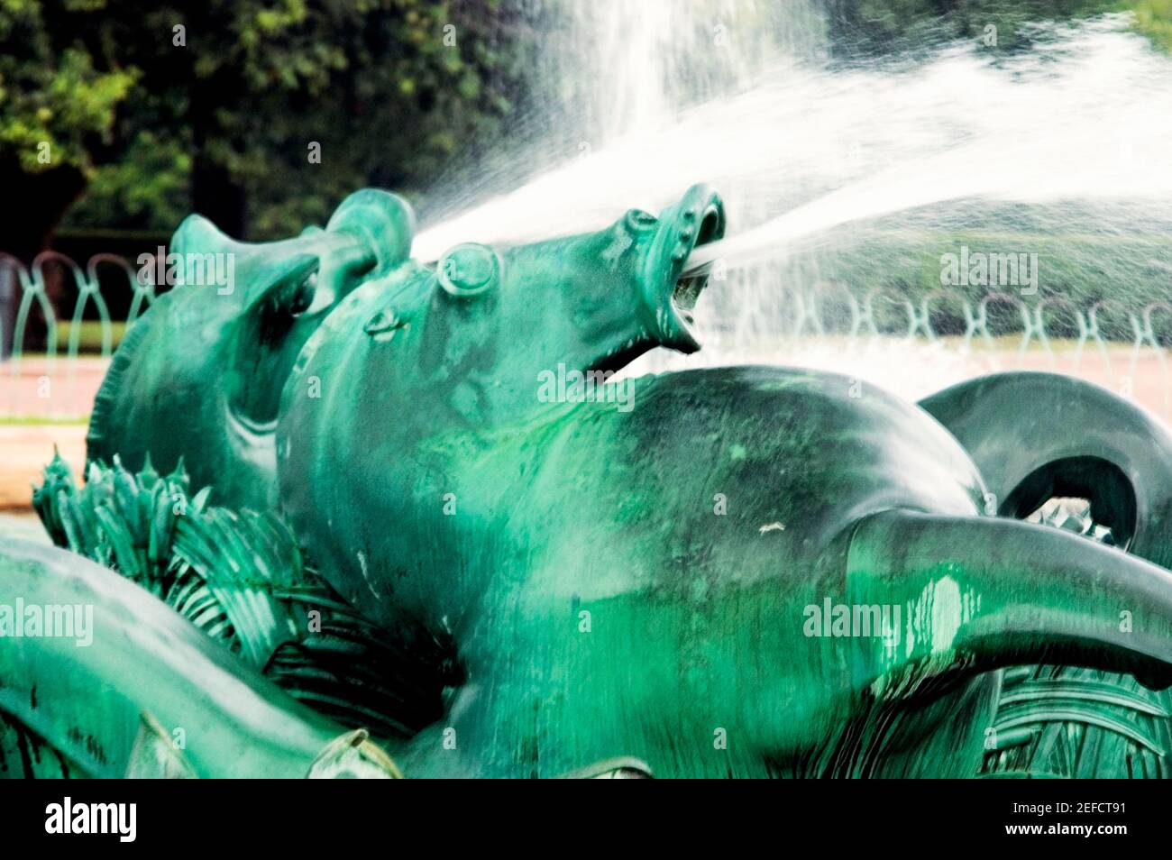Water spraying from the mouth of a bronze statue, Clarence Buckingham Fountain, Chicago