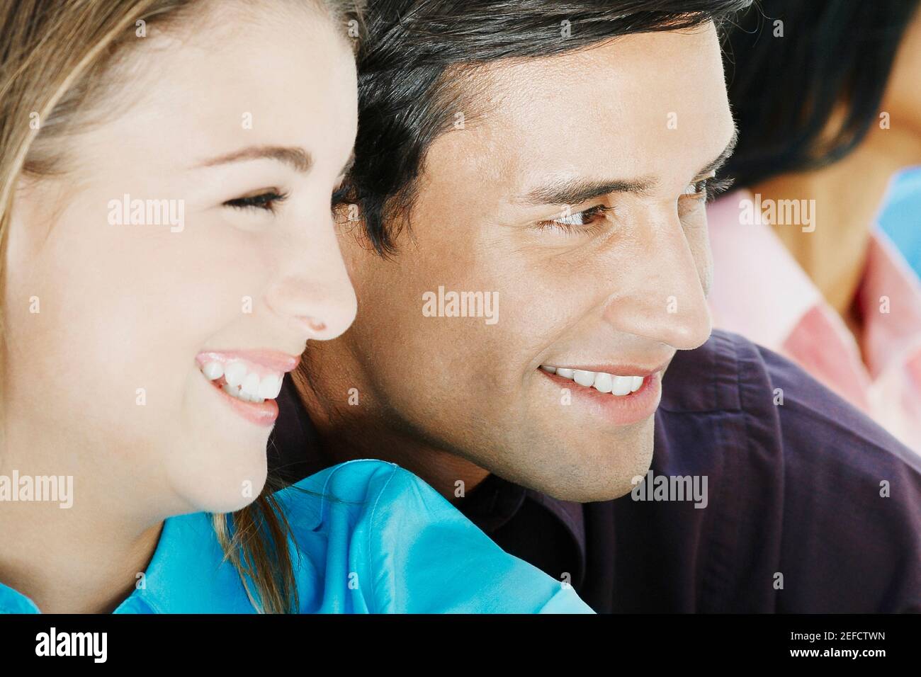 Close up of a teenage girl and a young man smiling Stock Photo - Alamy
