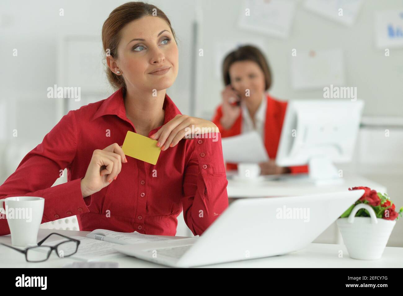 Businesswoman architect working in modern office with her colleague Stock Photo