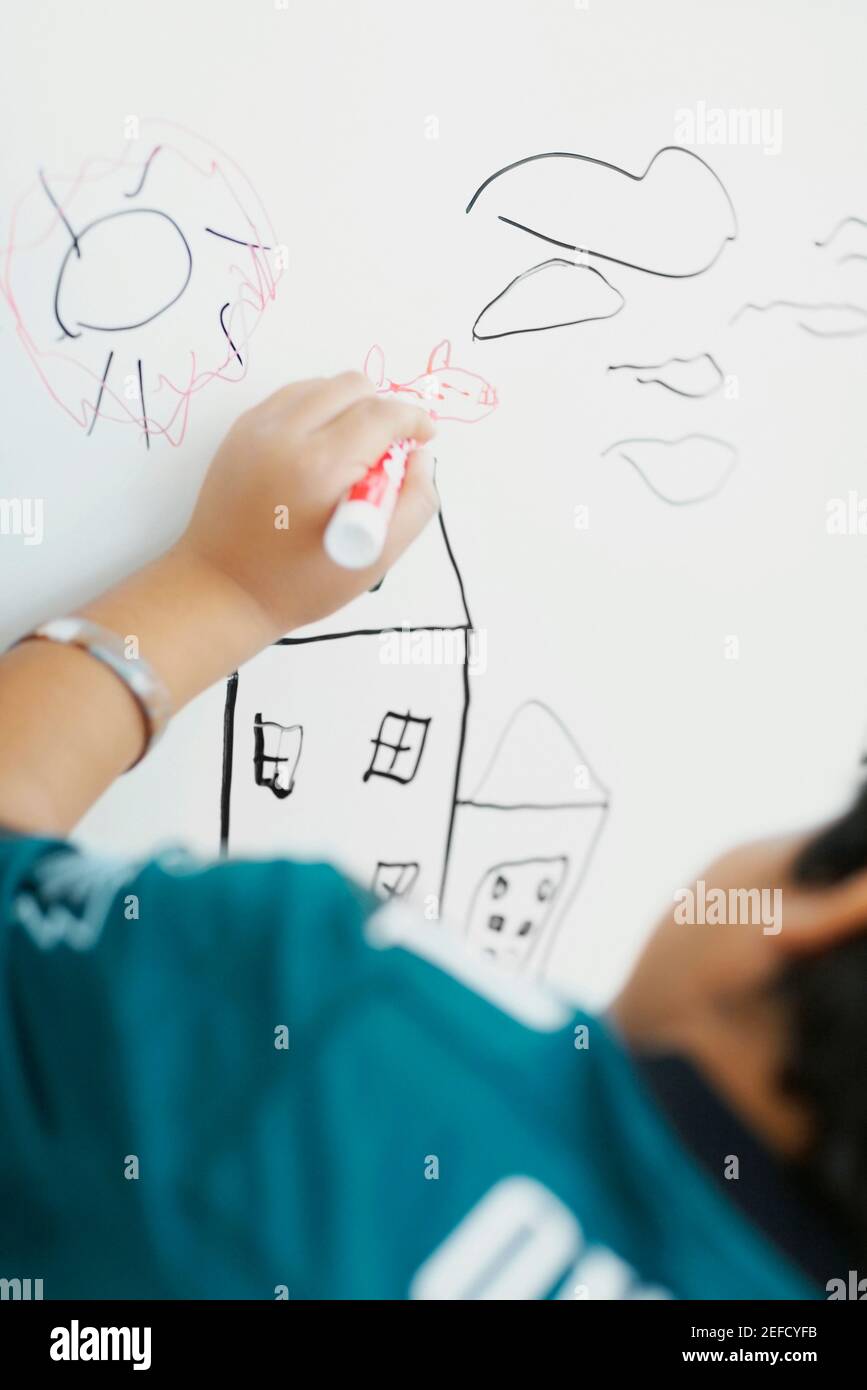 Rear view of a boy drawing sketch Stock Photo - Alamy